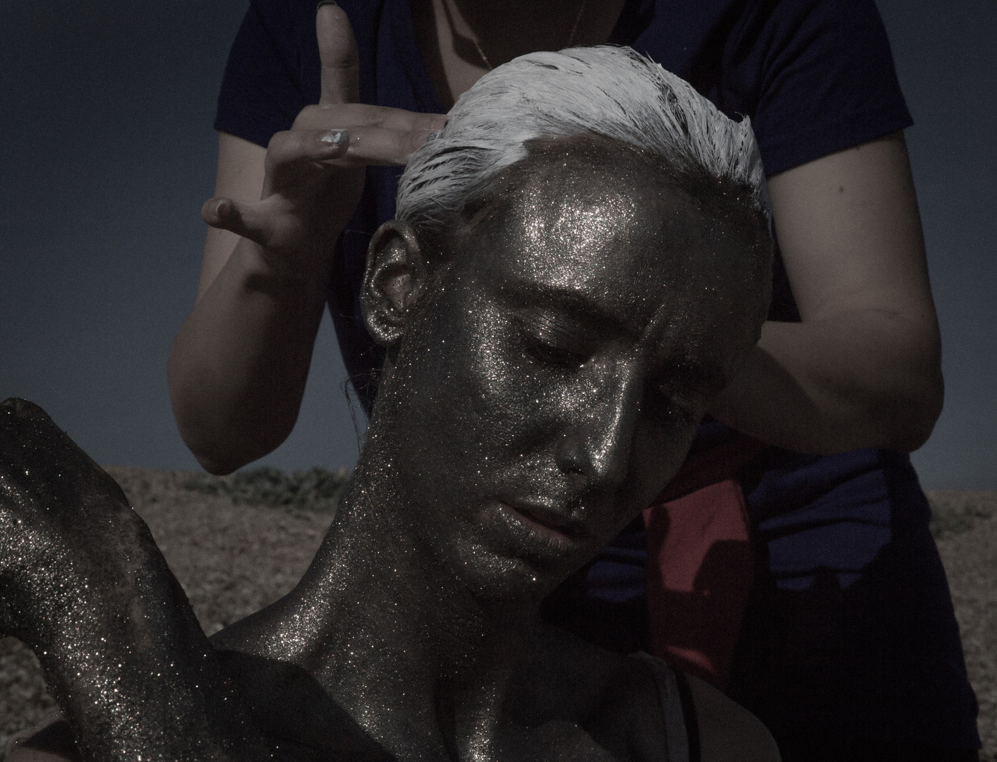 You Will Fail Her Behind the scenes still from You Will Fail Her, the lead actor has silver glitter make-up and hair dressing applied.