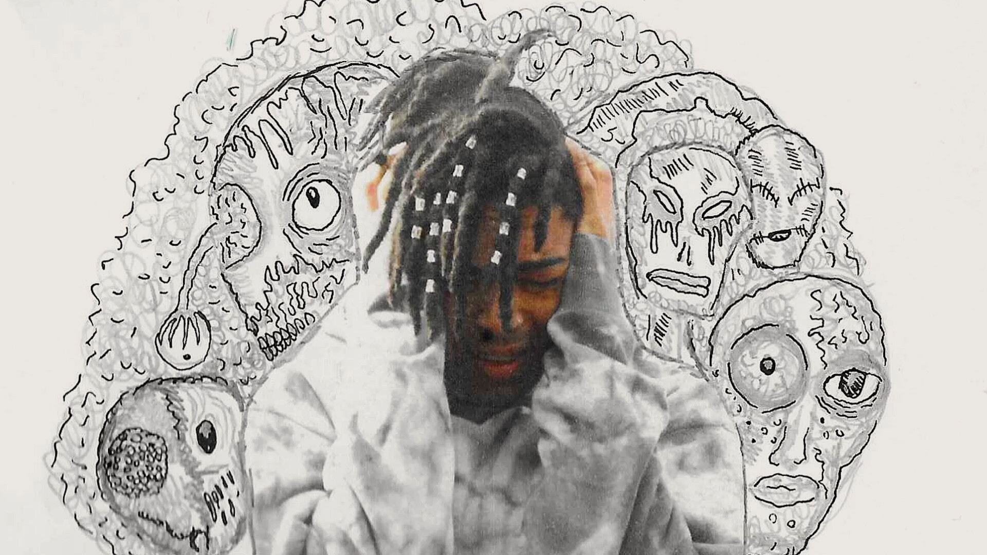 What I'm Hiding From You A still combining live action and animation. A man with locks holds his head in his hands, surrounded by illustrated alien faces.