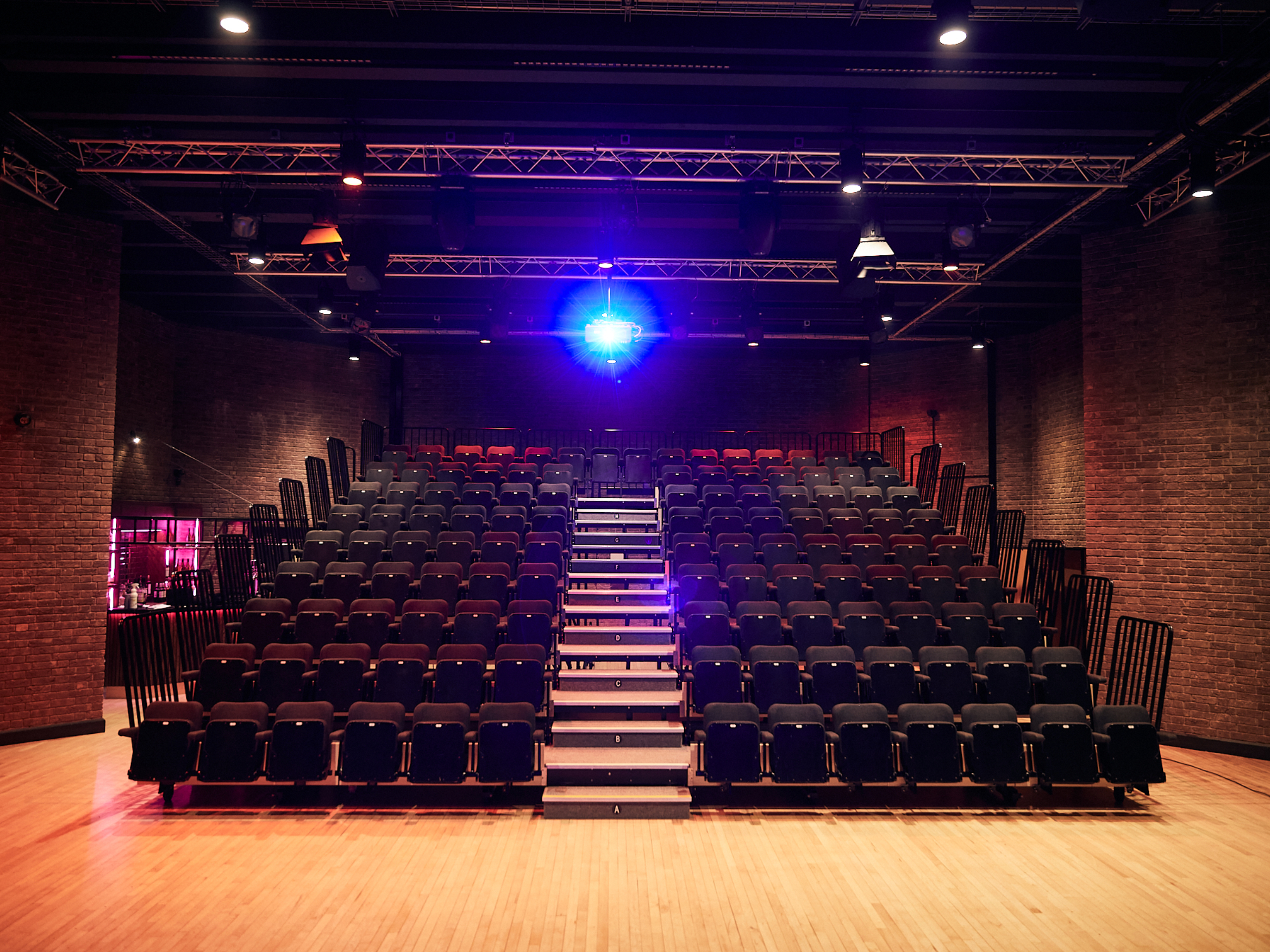 GCT seating Gosforth Civic Theatre theatre seating with projector shining in the background